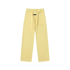 Fear Of God Essentials Tone‑on‑Tone Text Logo Straight‑Leg Sweatpants Pastel Yellow